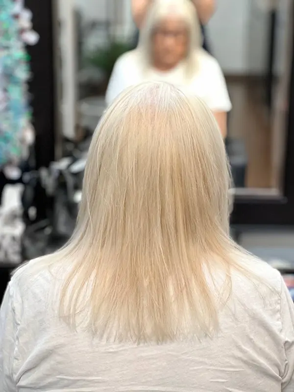 Platinum blonde hair after a professional hair bleaching service by CocoRez in Port Coquitlam.