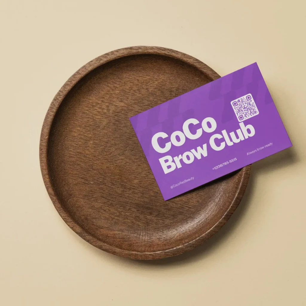 Coco Brow Club membership card on a wooden tray- Port Coquitlam