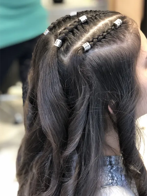 Double braided hairstyle with decorative beads created by CocoRez in Port Coquitlam.
