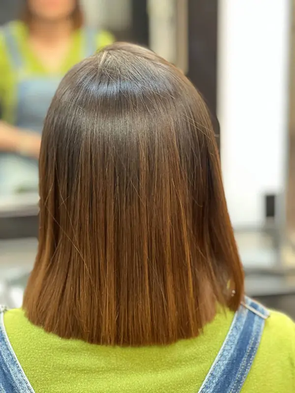 Smooth, healthy-looking hair after a professional smoothing treatment by CocoRez in Port Coquitlam.