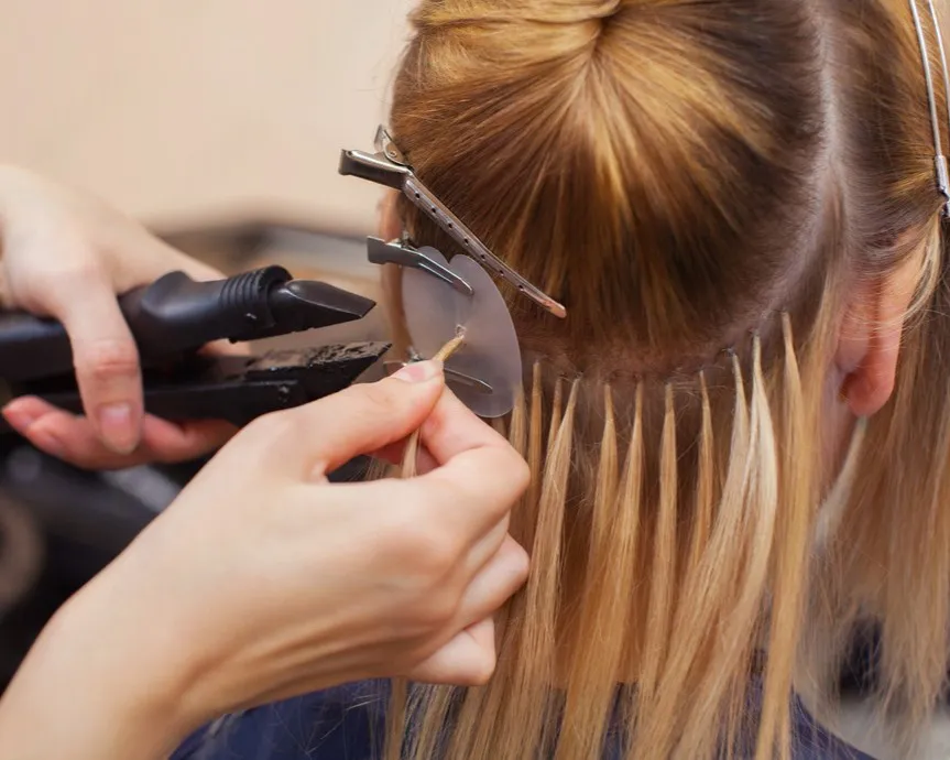 Professional hair extensions Port Coquitlam installation by CocoRez, strand by strand.