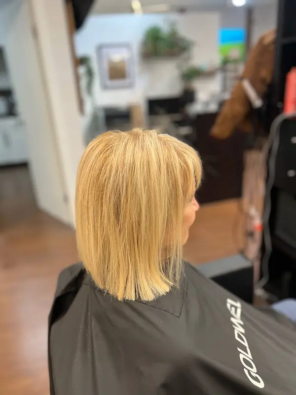 Natural-looking blonde hair after professional keratin hair extensions at CocoRez in Port Coquitlam.