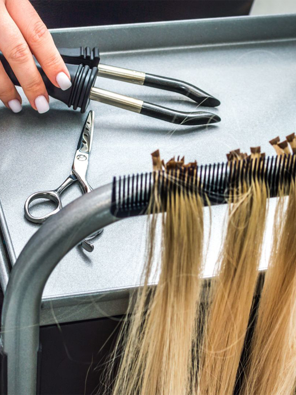 Keratin hair extension strands and professional installation tools prepared at CocoRez in Port Coquitlam.