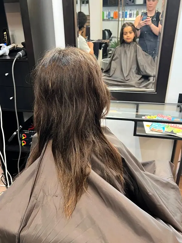 Before a kids haircut showing long hair before trimming at CocoRez in Port Coquitlam.