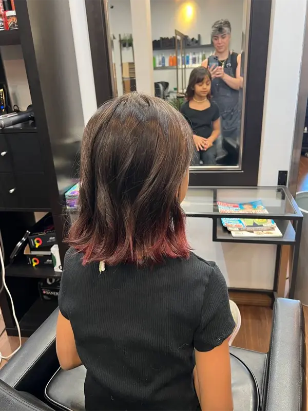 After a kids layered haircut with subtle red ends by CocoRez in Port Coquitlam.