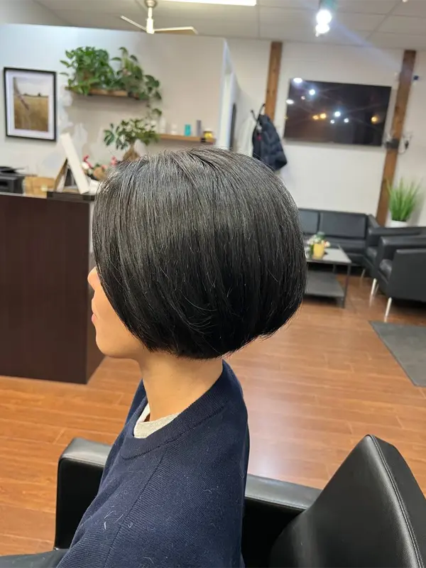 Long side bangs with a precision bob haircut by CocoRez in Port Coquitlam.
