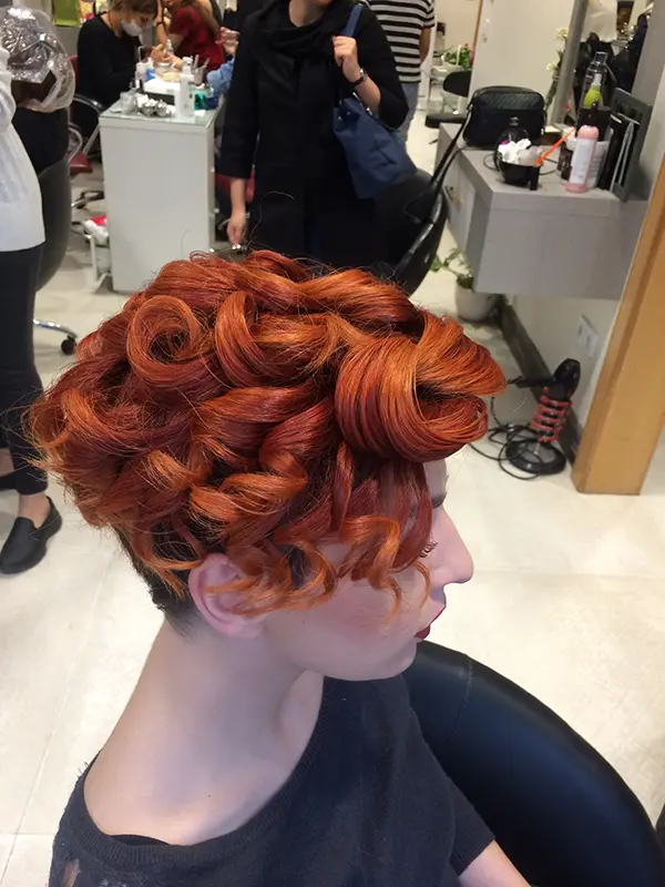 Creative copper updo with sculpted curls for a special occasion by CocoRez in Port Coquitlam.