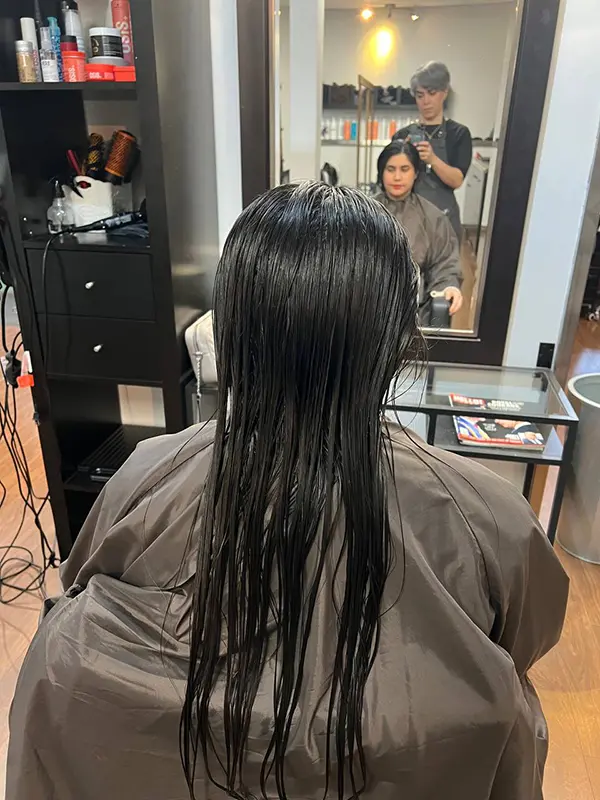 Before a women's bob haircut showing long straight hair at CocoRez in Port Coquitlam.