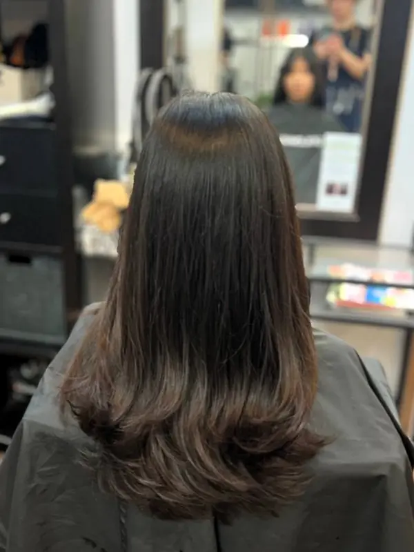 After a women's layered haircut with soft movement by CocoRez in Port Coquitlam.