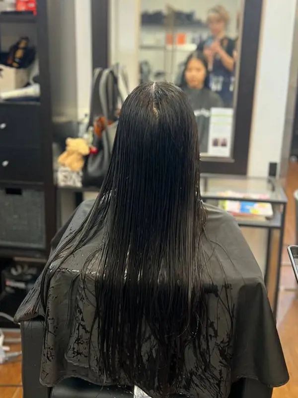 Before a women's haircut showing long straight hair at CocoRez in Port Coquitlam.