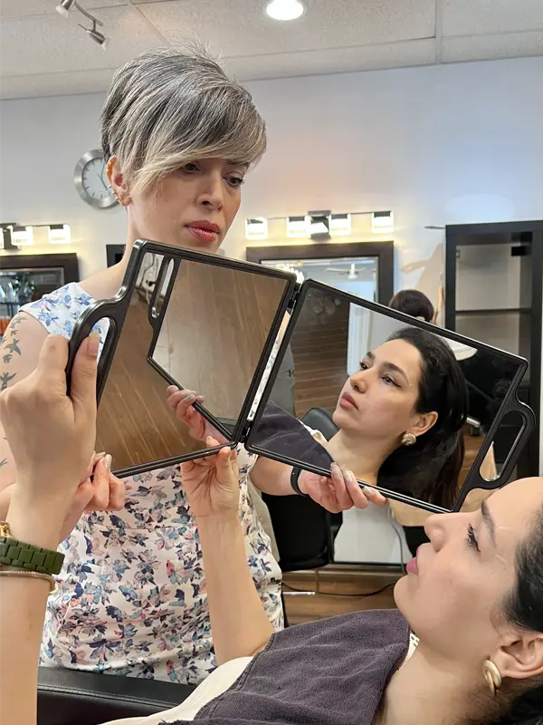 Client reviewing her eyebrow results with Coco after a professional eyebrow service at CocoRez in Port Coquitlam.